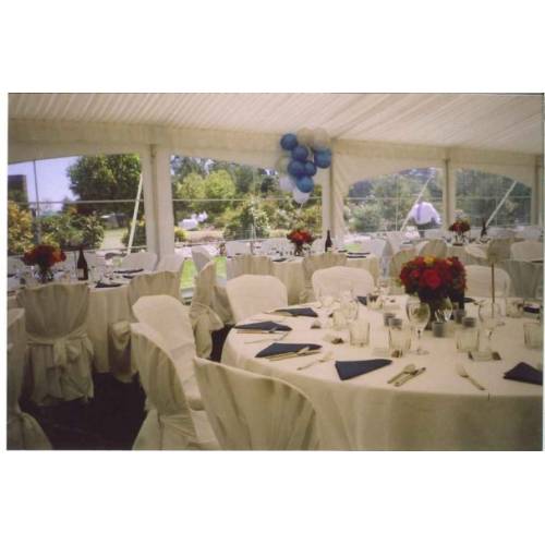 Table setting - Round Tables, White Linen and Covers
